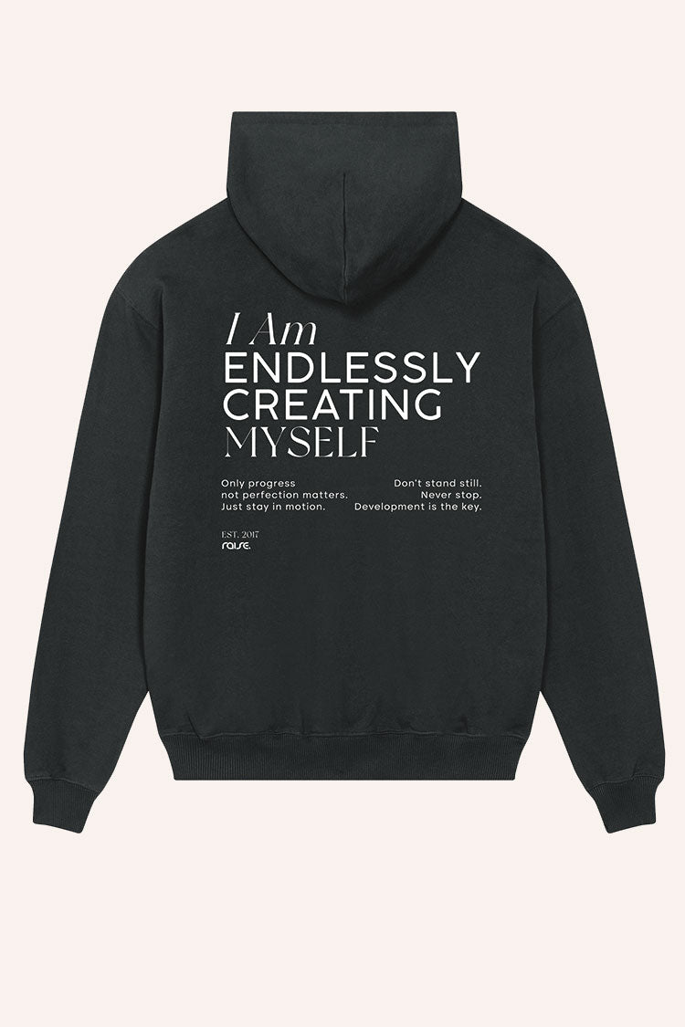 Schwarzer Oversize-Hoodie mit großem Statement-Print auf dem Rücken von raise Sportswear, moderne Streetwear für Sport und Alltag