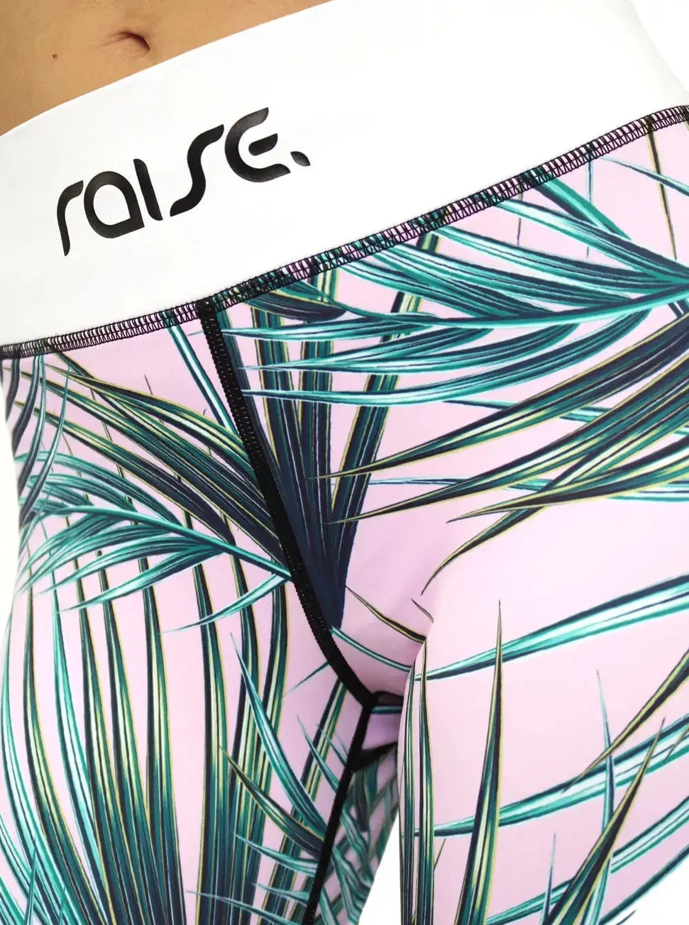 Detail Aufnahme von rosa Sport Leggings mit Palmen Print von raise Sportswear
