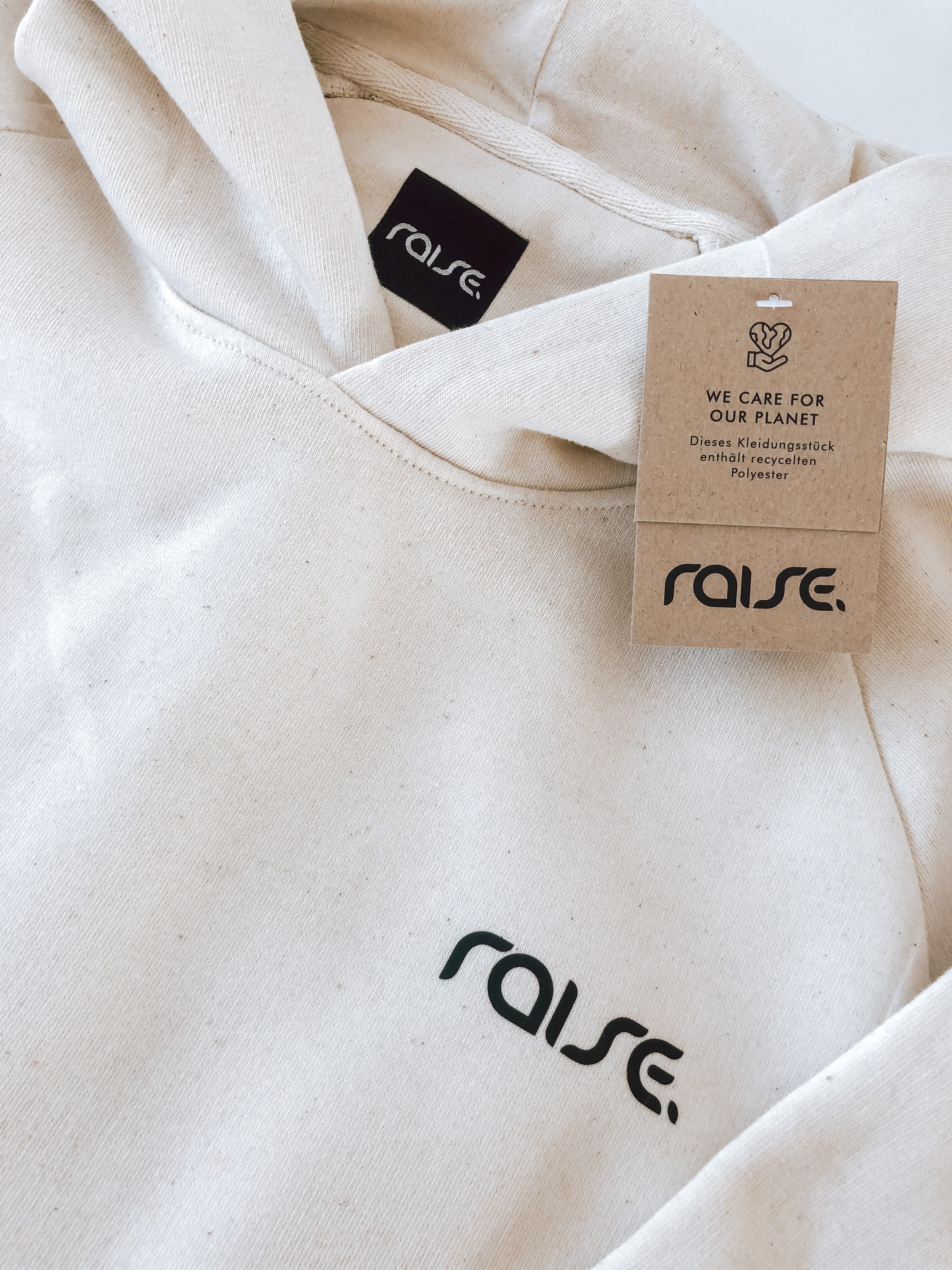 Weißer Damen Crop Hoodie mit Schnürung am Saum von raise Sportswear