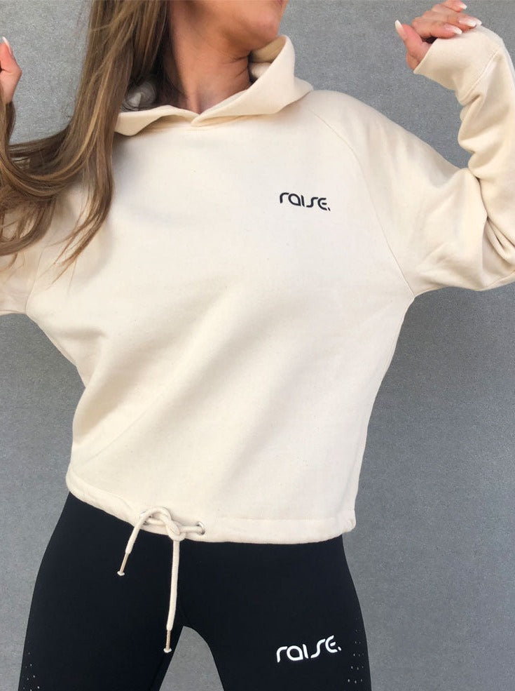 Weißer Damen Crop Hoodie mit Schnürung am Saum von raise Sportswear
