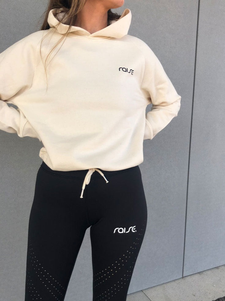 Weißer Damen Crop Hoodie mit Schnürung am Saum von raise Sportswear